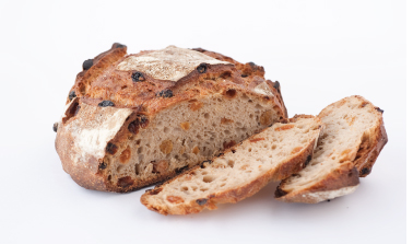 Baker holding bread
